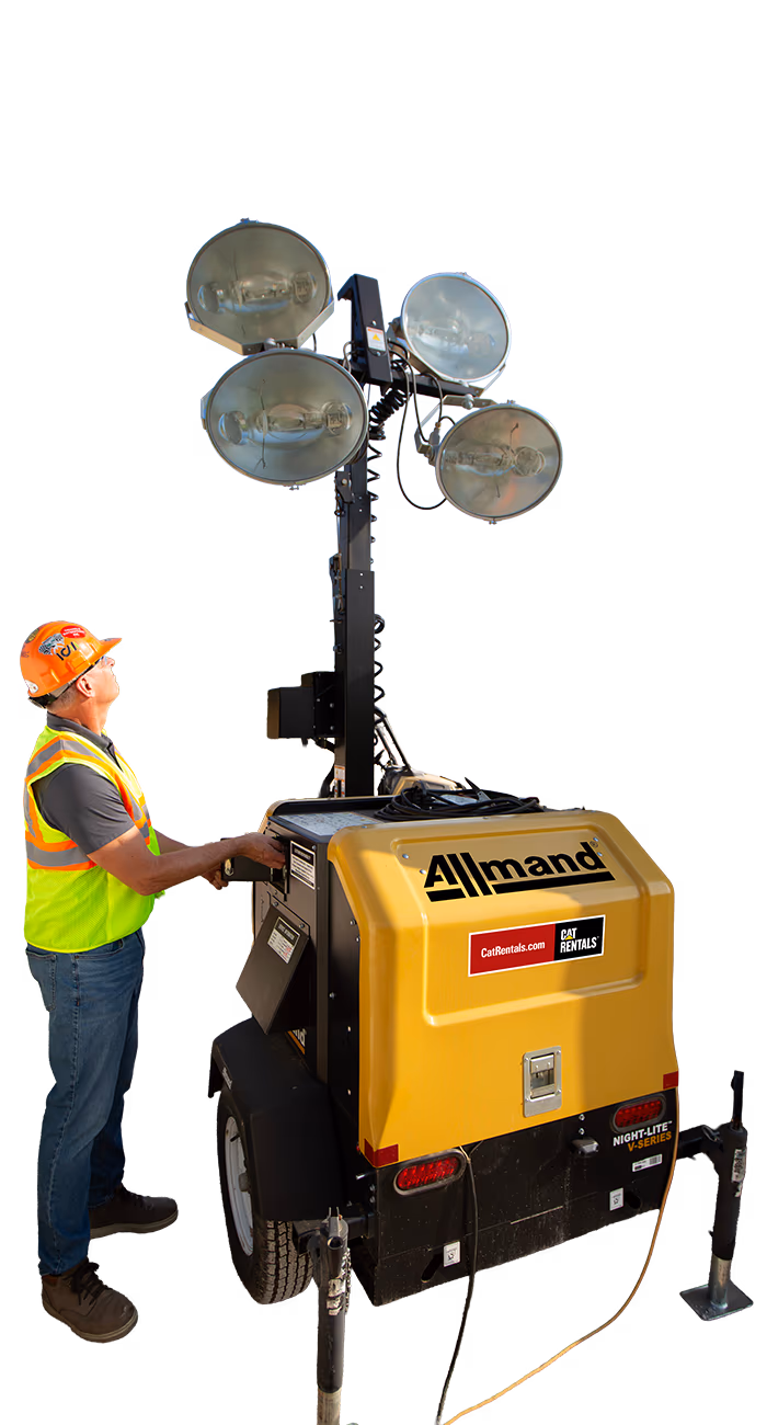Worker inspecting light tower